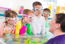 New at Bradley Fair: Why Moms Are Already Talking About Emler Swim School A group of children in a pool taking swimming lessons